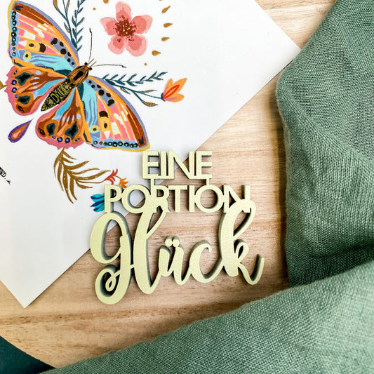 Schriftzug "Eine Portion Glück"